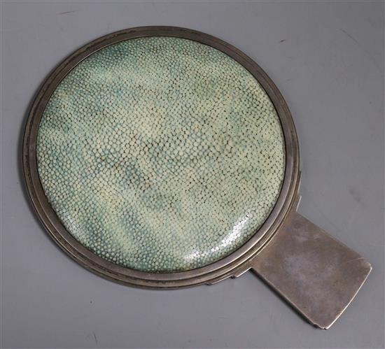 A silver circular hand mirror, the handle cast with the letter M, with shagreen reverse, 1928, diameter 6in. Provenance Lady Maufe